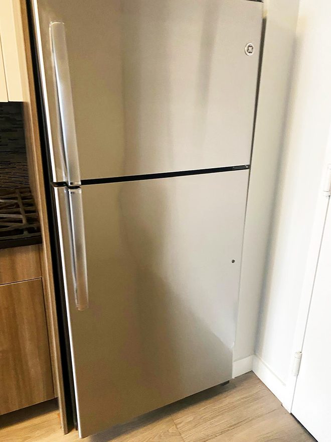 A clean stainless steel refrigerator exterior