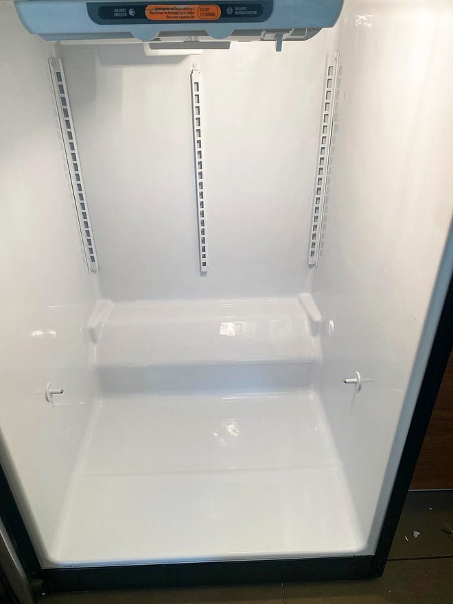 An empty freezer compartment, clean and dry