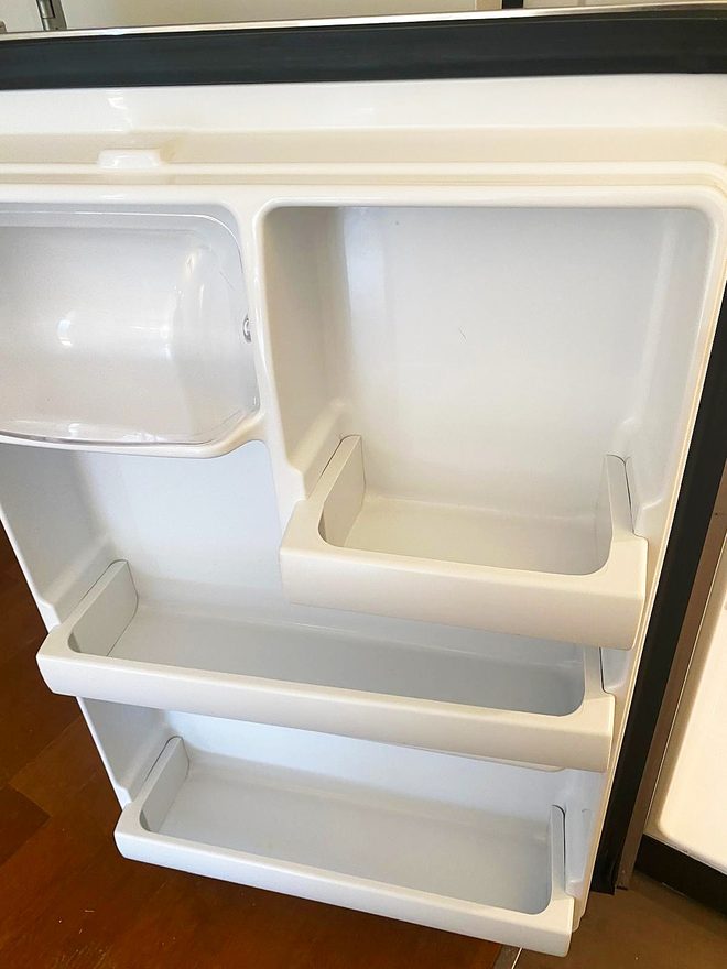 Clean refrigerator door shelves